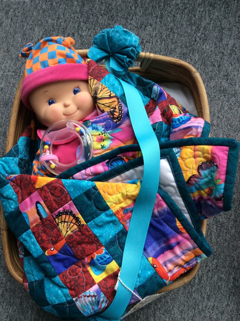 Handmade Doll quilt with Doll in a Moses basket. Etsy