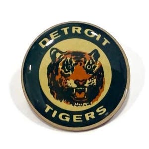 May include: A set of three ceramic mugs with a speckled, matte finish. The mugs are in shades of cream, light brown, and dark brown. Each mug has a simple, minimalist design, perfect for coffee or tea.