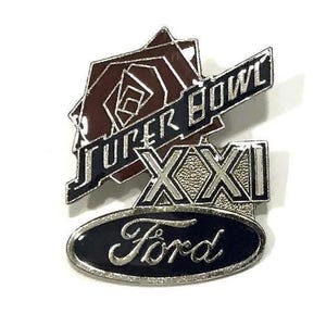 May include: A metal pin featuring the words "SUPER BOWL" and "XXI". The pin also includes a rose design and the Ford logo. The pin has a black, silver, and brown color scheme.
