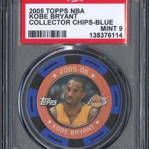 May include: A collectible blue and orange 2005 Topps NBA Kobe Bryant trading card. The card features a photo of Kobe Bryant in a Lakers uniform and the text "2005-06". The card is graded Mint 9 by PSA and encased in a protective holder.