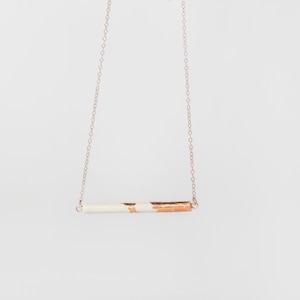 Dainty Rosegold Bar Necklace with White Clay Pendant Dipped in Rosegold. On a Rosegold filled chain. As seen in GRAZIA.