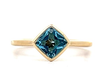 Square Cut Bezel Set Blue Topaz in 14k Yellow Gold