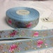 Jan Wentzlaff reviewed Vintage Jacquard Floral Ribbon Collection. Sold by the yard. Acetate, Made in France, 1 1/8 Wide.