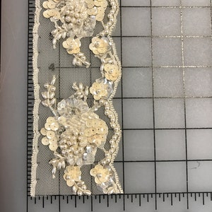 Ivory Beaded Appliqué Trims. Sold by the yard.Beaded Trims, Beaded Motif, Motif, Trims.