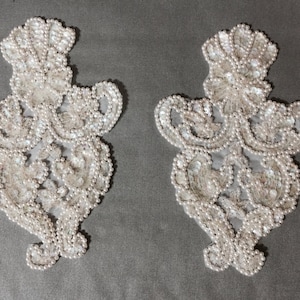 Appliqués. Embroidered and beaded appliqué with sequence 2 pieces listing.