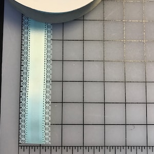 Blue satin lace edge ribbons. Sold by the Roll of 25 yards.
