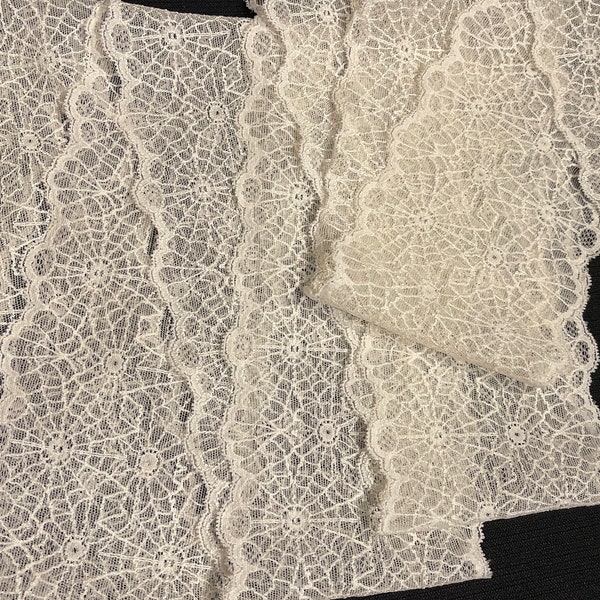 Lovely stretch lace Ivory. Made in USA. 5 Inches wide. Sold by the Yard.