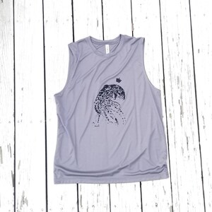 May include: A light gray sleeveless shirt with a black and white graphic of an octopus wearing a crown.