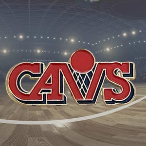 May include: A red, white, and blue Cavs pin with a basketball hoop design. The pin features the word "CAVS" in bold, red letters with a gold outline. The background shows a basketball court.