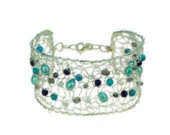 Bracelet "Susanne" knitted in silver with freshwater pearls, turquoise, lapis lazuli and moon stone.