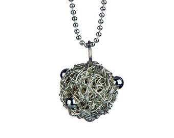 Pendant "Nina " Knitted silverball with small silver beads.
