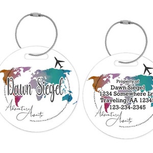 May include: Two round luggage tags with a watercolor world map design. The tag on the left says "Dawn Siegel Adventure Awaits". The tag on the right says "Property of Dawn Siegel 1234 Somewhere Ln. Traveling, AA 12345 123-234-2345 Adventure Awaits".