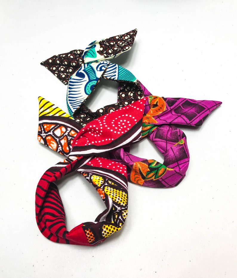 3 little darlings with African wax buns wrap inner wire bun