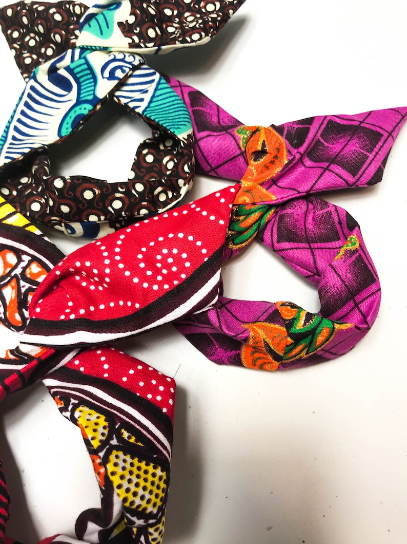 3 little darlings with African wax buns wrap inner wire bun