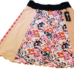 T-Skirt (Large) above-the-knee- Orange, Black Abstract Floral    Fun and easy to wear repurposed knit skirt.