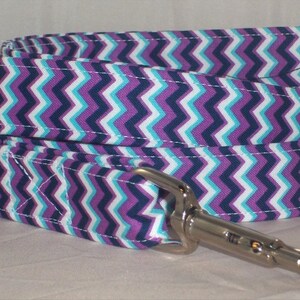 May include: Purple, white, and blue chevron patterned dog leash with a silver clip.