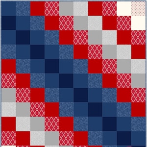May include: A quilt pattern with red, white, and blue squares. The squares are arranged in a diagonal pattern. The quilt is made by Busy Hands Quilts, a small business that makes handmade quilts.
