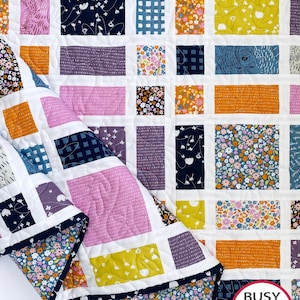 May include: A set of three ceramic mugs with a speckled, matte finish. The mugs are in shades of cream, light gray, and dark gray. Each mug has a simple, minimalist design, perfect for coffee or tea.