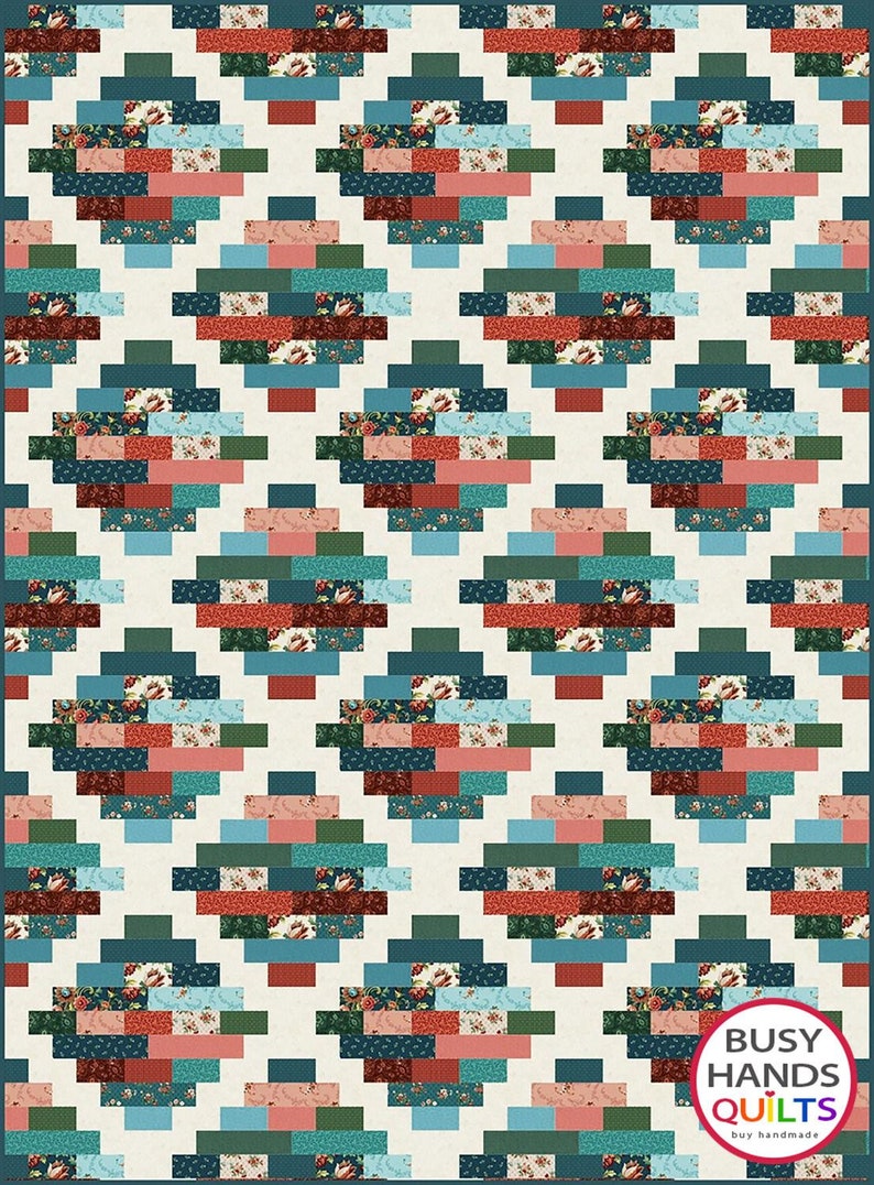 May include: A quilt pattern with a geometric design featuring teal, red, pink, and green squares and rectangles. The quilt is made with a variety of floral patterned fabrics. The quilt is labeled "Busy Hands Quilts" with the tagline "buy handmade".