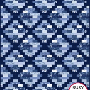 May include: A blue and white quilt with a geometric pattern. The quilt is made up of squares and rectangles of different shades of blue and white. The quilt is edged with a dark blue border. The quilt is made by Busy Hands Quilts.