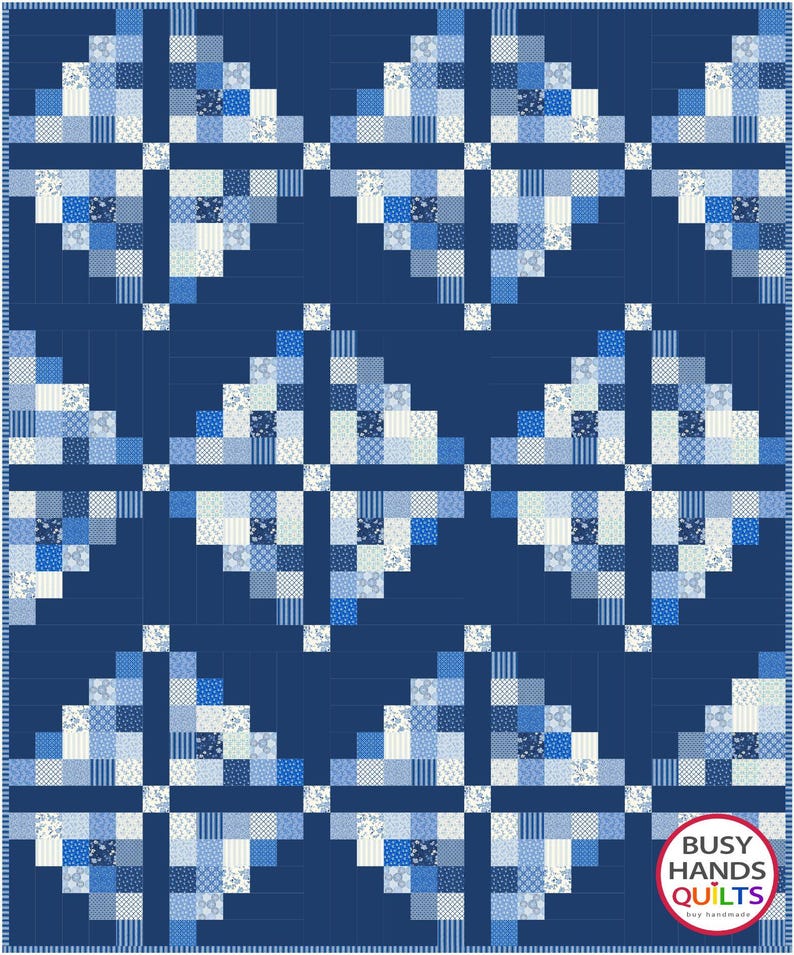 May include: A quilt pattern with a blue background and white and blue squares arranged in a geometric design. The quilt is titled "Busy Hands Quilts" with the tagline "buy handmade".