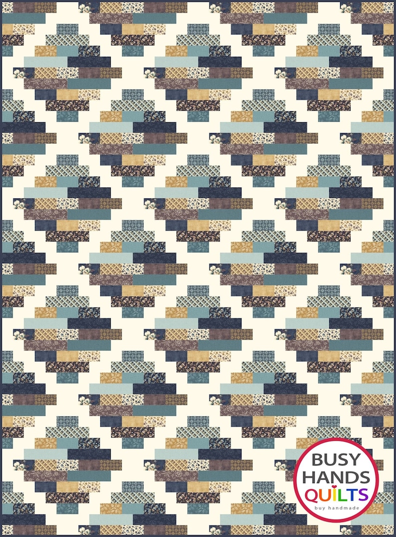 May include: A quilt with a geometric pattern in shades of blue, brown, and beige. The quilt is made up of small squares and rectangles, and the pattern is repeated throughout the quilt. The quilt is bordered by a white fabric. The quilt is labeled "Busy Hands Quilts" in a red circle with white text.
