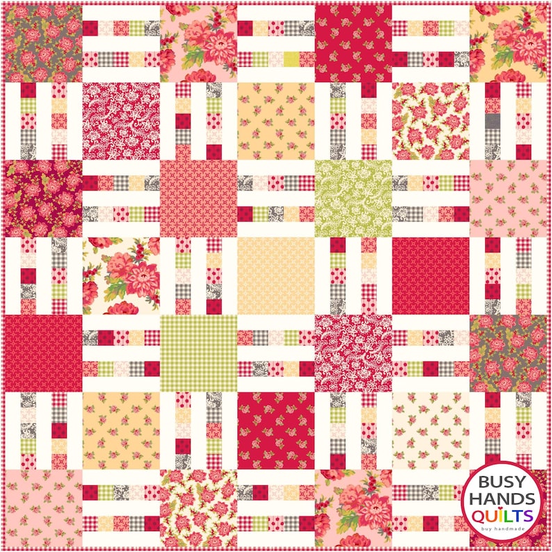May include: A quilt pattern with a grid of squares in various floral prints, including pink, red, and green. The squares are separated by white strips with a checkered pattern. The quilt is bordered by a white frame with a checkered pattern. The text "Busy Hands Quilts" is in the bottom right corner.
