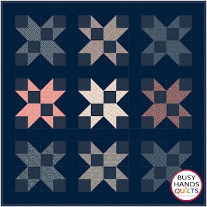 May include: Nine quilt blocks in a 3x3 grid, each featuring a star design with a different fabric pattern. The blocks are on a dark blue background. The bottom right block has the text "Busy Hands Quilts" in a white circle with a rainbow border.