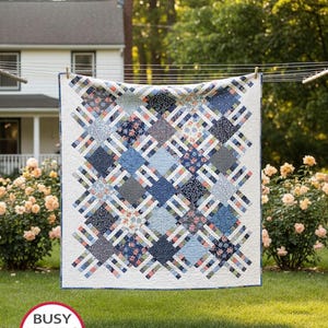 May include: A quilt featuring a repeating geometric pattern of blue, white, and coral fabric squares and strips. The text on the image reads: Home Awaits, BUSY HANDS QUILTS, Baby, Small Lap, Large Lap, Twin use 10" squares, Queen and King use 10" squares and 2½" strips, Includes 6 Sizes!, Designed by Myra Barnes, Busy Hands Quilts.