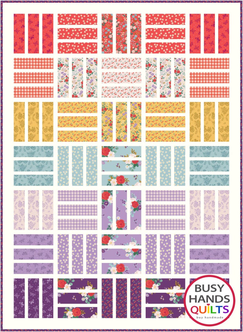 May include: A quilt pattern with a variety of floral prints in shades of red, yellow, blue, purple, and white. The quilt is made up of horizontal and vertical strips of fabric, creating a grid-like pattern. The quilt is framed by a white border with a purple trim. The bottom right corner of the quilt features a logo that reads "Busy Hands Quilts" with the tagline "buy handmade".