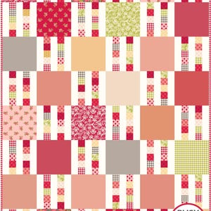 May include: A patchwork quilt with a white background and squares of various colors and patterns, including red, pink, orange, green, and floral prints. The quilt is made up of 9 rows of 9 squares. The quilt is labeled "Busy Hands Quilts" in the bottom right corner.