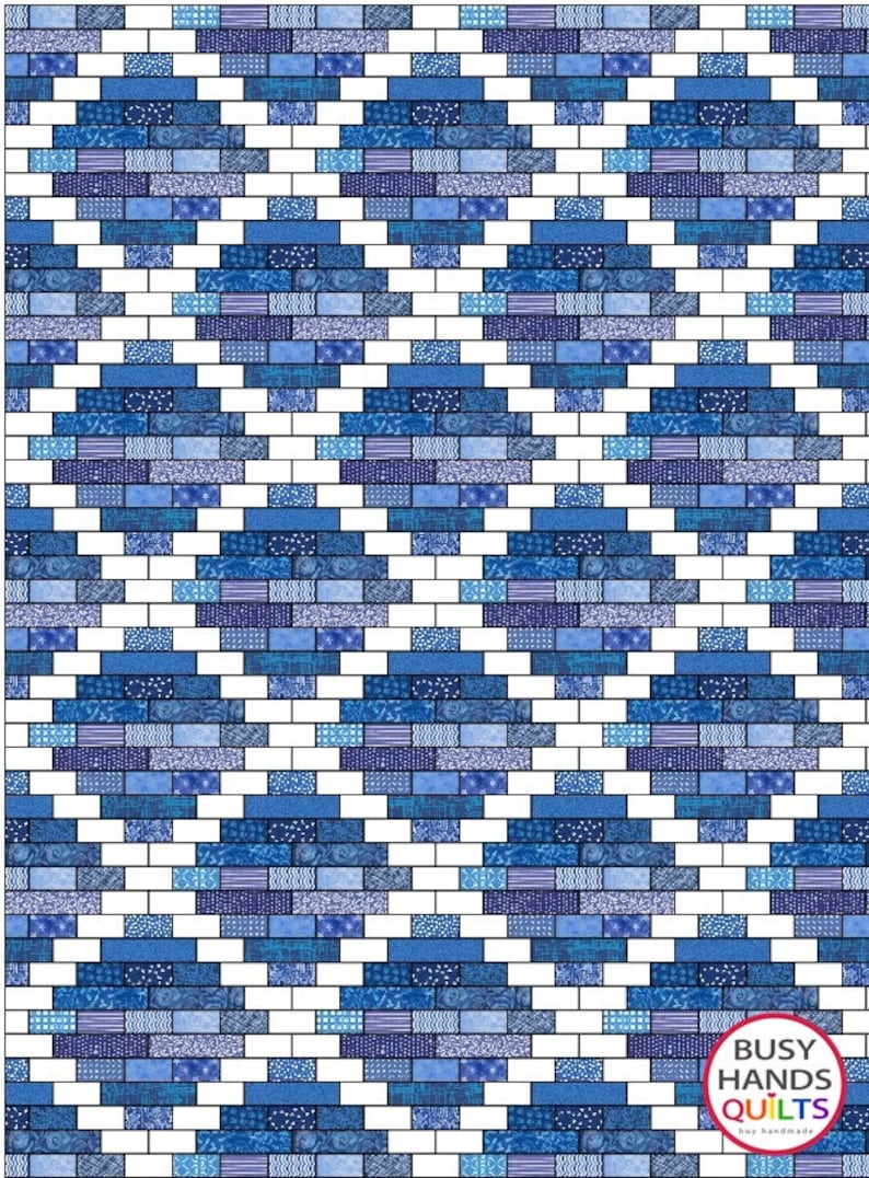 May include: A quilt pattern with a brick design in shades of blue and white. The pattern is made up of small squares and rectangles. The quilt is finished with a label that says "Busy Hands Quilts".
