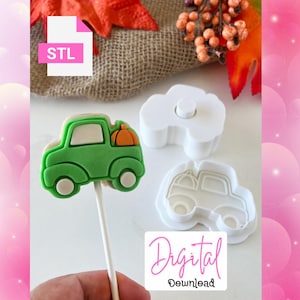 May include: A green truck-shaped cookie on a stick with an orange pumpkin in the bed. Two white plastic cookie cutters and the text "Digital Download" are also visible. The file icon says "STL".
