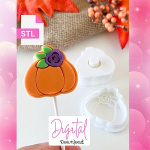 May include: An orange pumpkin-shaped confection on a stick, decorated with a purple flower and green leaves. Next to it are two white pumpkin-shaped molds. The image includes the text "STL" and "Digital Download".