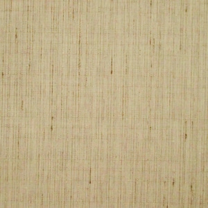 May include: Close-up of a textured, beige fabric with vertical lines and subtle variations in color. The material has a natural, woven appearance, suggesting a linen or similar textile. The surface is evenly lit, highlighting the texture.