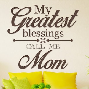 May include: Brown vinyl wall decal with the text "My greatest blessings call me Mom" in a decorative script font.