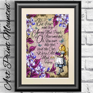 May include: Framed art print featuring a quote from Alice in Wonderland. The print has a vintage aesthetic with floral and butterfly accents. The quote reads, "But I don't want to go Among Mad People." The image includes a depiction of Alice.