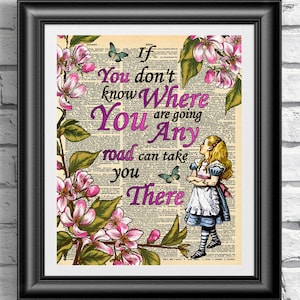 May include: A vintage book page with a quote from Alice in Wonderland: "If you don't know where you are going, any road can take you there." The quote is printed in pink and purple text. The page is decorated with a floral illustration of pink blossoms and green leaves. A cartoon image of Alice from Alice in Wonderland is standing on the right side of the page.