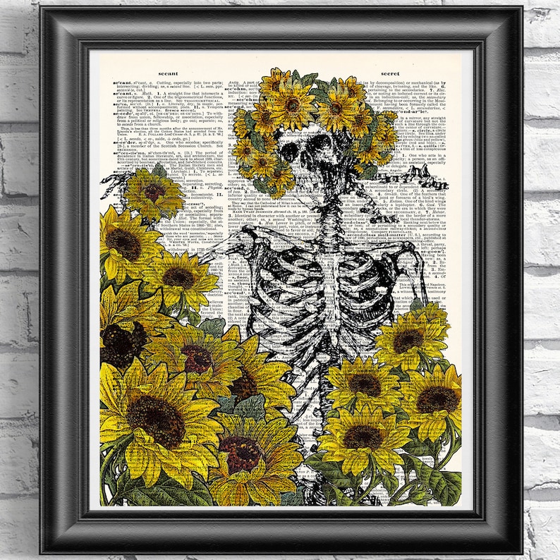 May include: A black and white skeleton wearing a crown of sunflowers. The skeleton is surrounded by sunflowers on a vintage dictionary page.