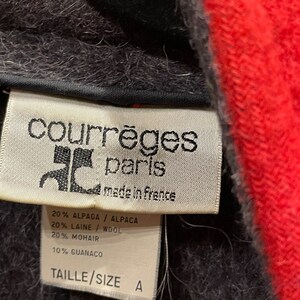 May include: A white tag with black text that reads "courr&egrave;ges paris made in frence" and lists the fabric composition: 20% Alpaca, 20% Wool, 20% Mohair, 10% Guanaco. The tag also says "Taille/Size A".