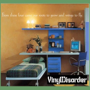 May include: A blue and white bedroom with a desk, a bed, and a computer. The wall has a quote that reads "From these four came our roots to grow and wings to fly."