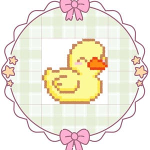 May include: A pixel art illustration of a yellow duck with an orange beak and pink cheeks, centred within a circular frame featuring a light green plaid pattern, decorated with small stars and pink bows at the top and bottom edges.