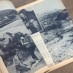 May include: An open vintage magazine with black and white photographs and text. The images depict outdoor scenes and people. The magazine is open on a wooden surface.