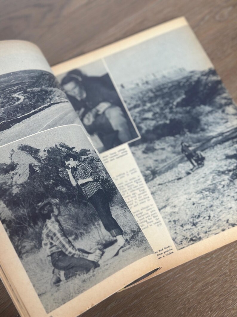 May include: An open vintage magazine with black and white photographs and text. The images depict outdoor scenes and people. The magazine is open on a wooden surface.