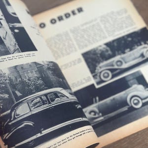 May include: Open magazine pages featuring vintage car illustrations in black and white. The text "TO ORDER" is visible, along with other text. The pages are slightly yellowed with age, suggesting a classic or historical theme.