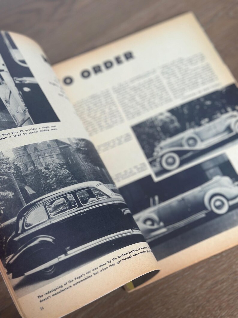 May include: Open magazine pages featuring vintage car illustrations in black and white. The text "TO ORDER" is visible, along with other text. The pages are slightly yellowed with age, suggesting a classic or historical theme.