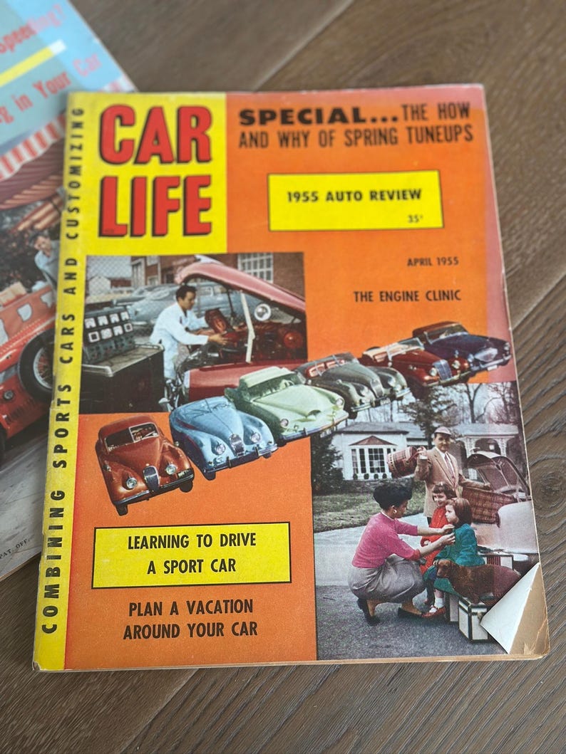 May include: Vintage April 1955 issue of Car Life magazine. The cover is orange with the title "CAR LIFE" in large red and yellow letters. Features include "1955 Auto Review" and "Learning to Drive a Sport Car."