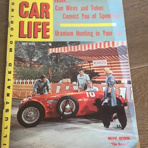 May include: Vintage July 1955 issue of Car Life magazine. The cover features a red race car with the number 10, surrounded by people. The magazine's title is in large, bold letters. The cover also includes the text "Radar... Can Wires and Tubes Convict You of Speeding?"
