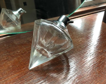 Unusual shaped clear glass perfume bottle (empty) all in good working order. Can be refilled with your own perfume.