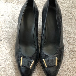 Black leather pumps (court shoes) with gold buckle to front and tampered 2.5” heels. UK size 4.5 US 6.5 Eu37.5